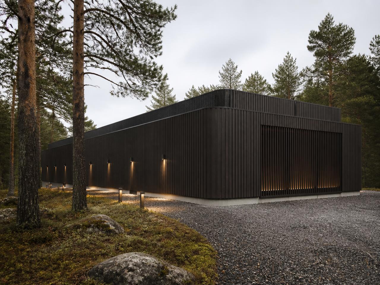 Modern Nordic data center building in a pine forest