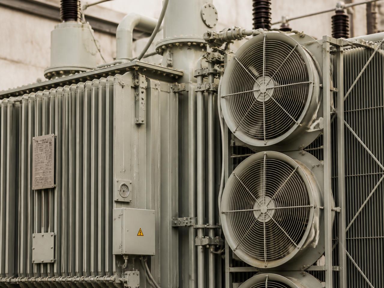 Close-up of a power transformer with cooling equipment